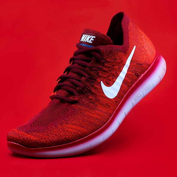 Red sneaker on a red background
